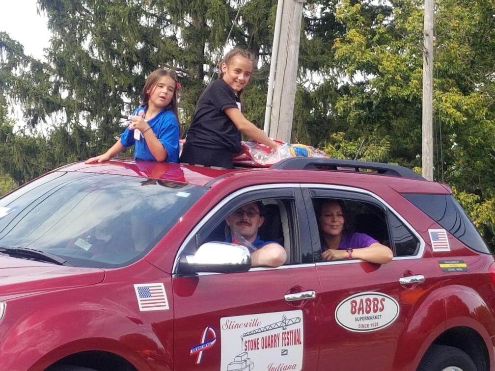 babbs supermarket employees on a parade route near spencer indiana